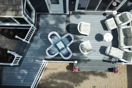 a patio area with chairs and a table